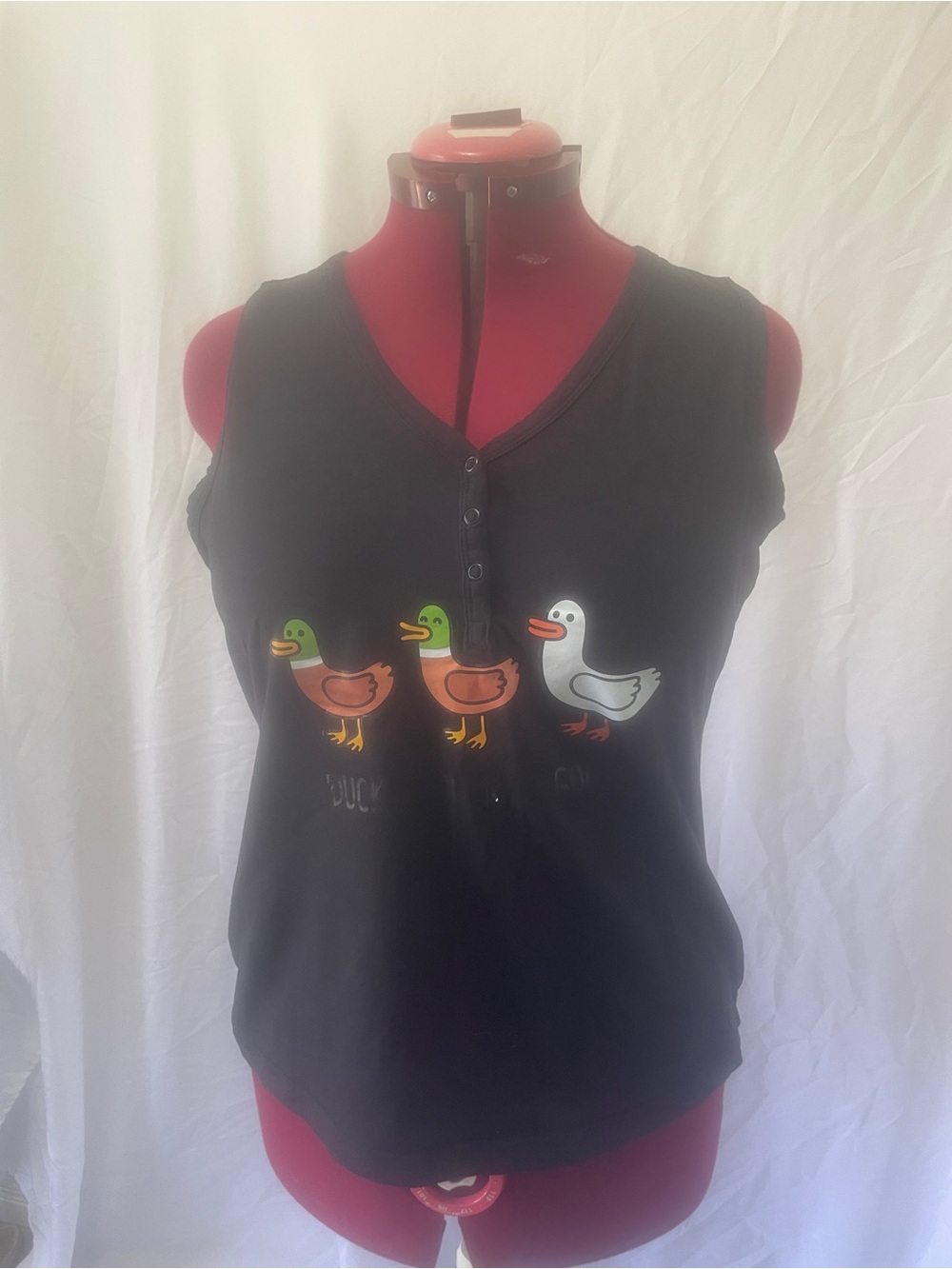 just be Black Sleeveless Henley Top with Duck Graphic